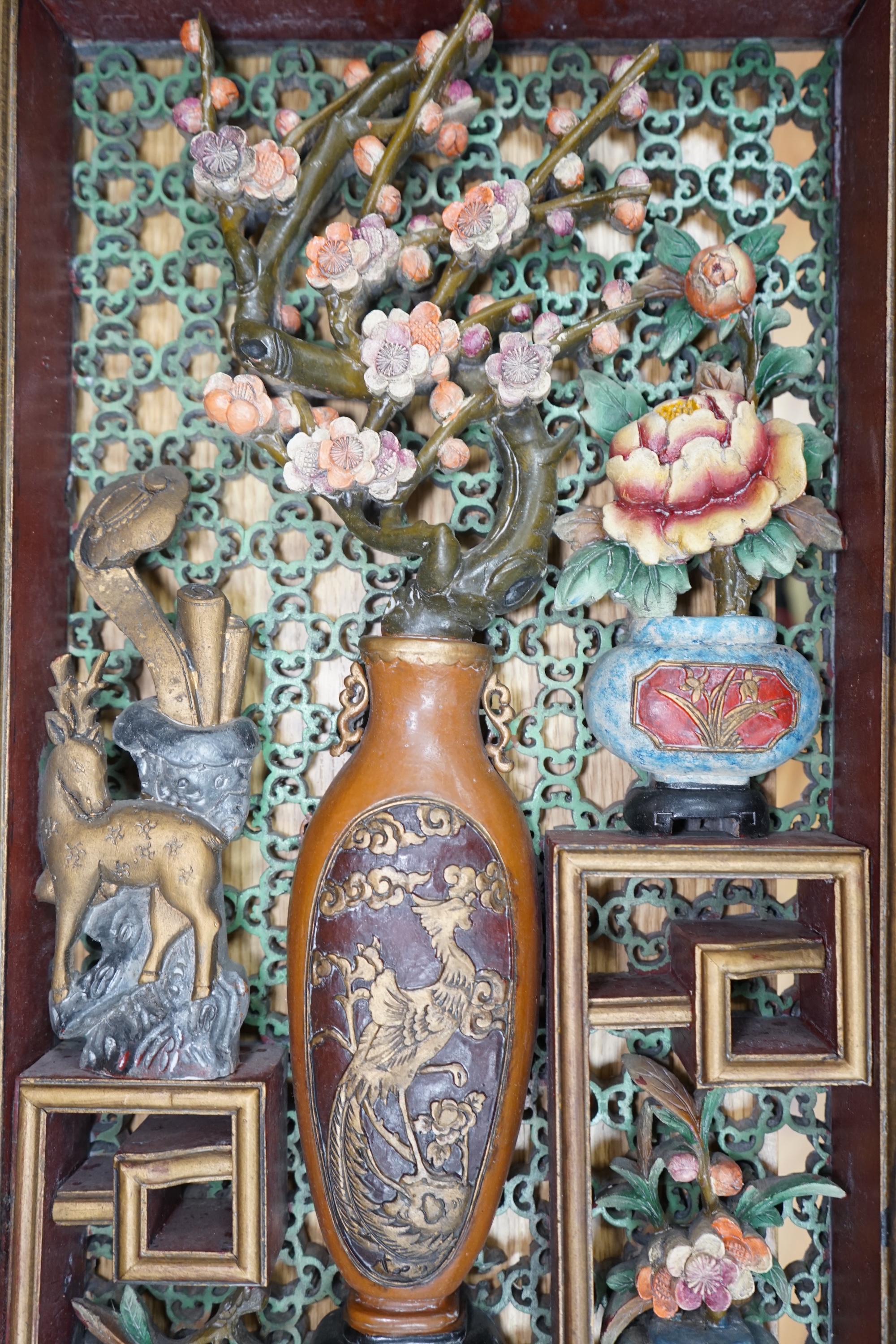 A Chinese polychrome painted carved wood wall panel, 59.5 x 31cm. Condition - fair to good